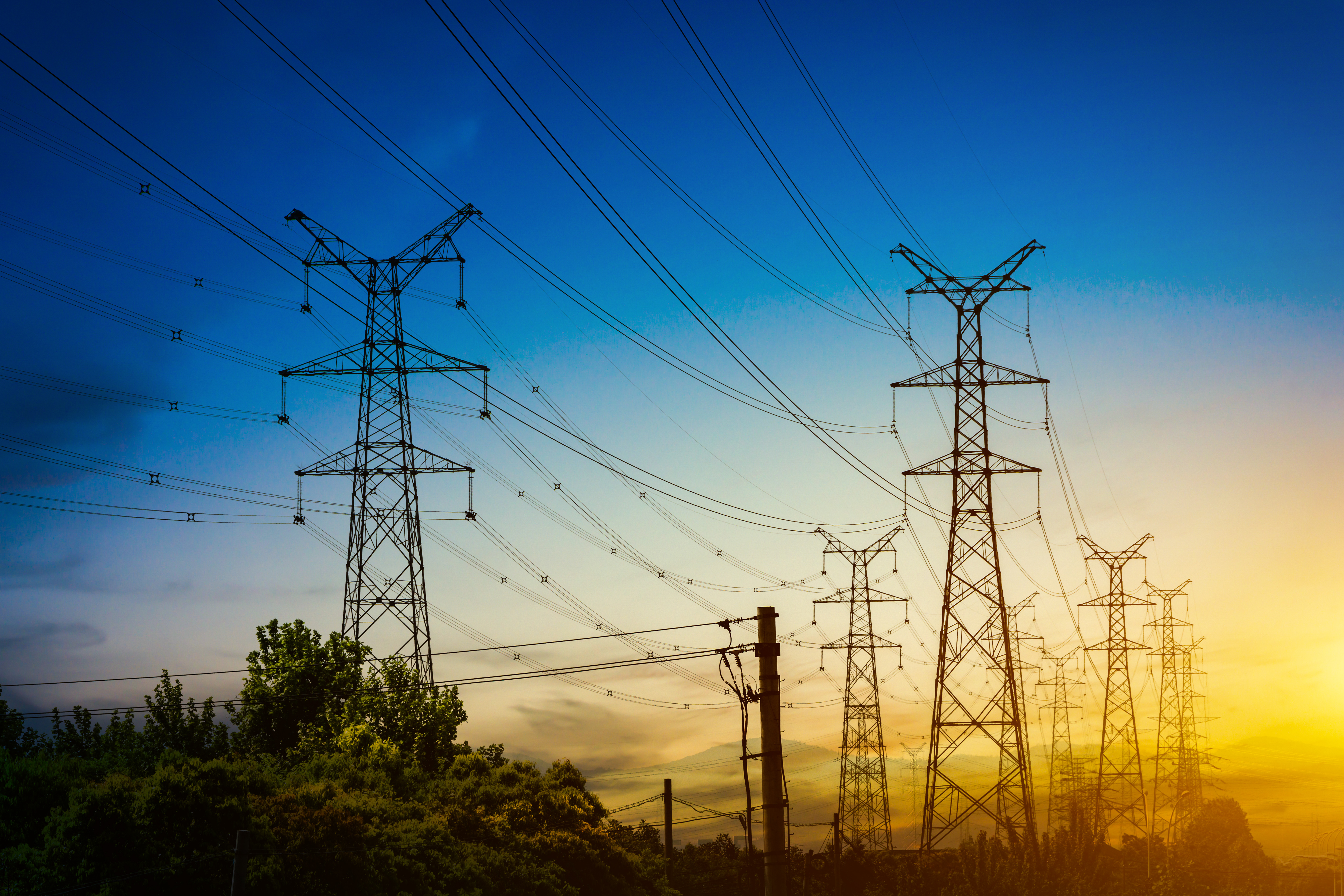 sun-setting-silhouette-electricity-pylons_freepik.jpeg